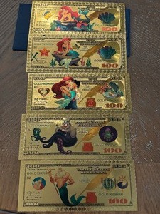 lot 65 image: 24K Gold Little Mermaid $100 Dollar Notes