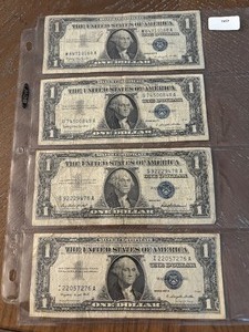 lot 66 image: 1957 Blue Seal $1 Dollar Silver Certificates