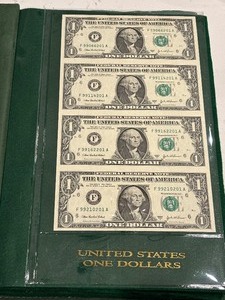 lot 75 image: Uncut Sheets of U.S. Currency and Book