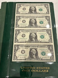 lot 76 image: Uncut Sheets of U.S. Currency and Book