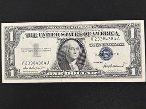 lot 26 image: 1957 Blue Seal $1 Dollar Silver Certificate Uncirculated