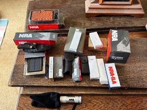 lot 33 image: NRA Knives, Flashlights, and More
