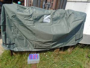 lot 122 image: Kenmore grill cover. Approx 56 x 25 x 44. As shown.