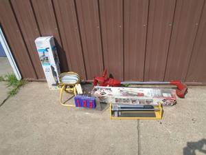 lot 123 image: Assortment of tile cutterwork light & black & decker vacuum As shown.