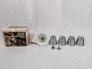 lot 22 image: KitchenAid Rotor Slicer Shredder Attachment