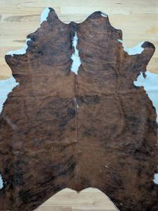 lot 66 image: Brown and White Cowhide Rug