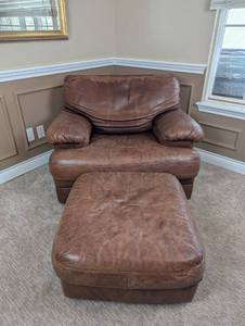 lot 99 image: Leather Armchair and Ottoman Set