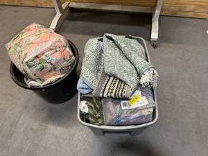 lot 200 image: Bin of rugs, pillows, bedsheets