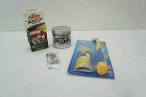 lot 167 image: Turtle Wax Scratch Repair Kit, Never Dull Polish, Windex Sonic Scrubber & Skull Door Lock Knobs
