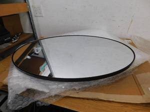lot 106 image: Litton Lane 31 in. x 18 in. Oval Shaped Round Framed Black Wall Mirror with Thin Minimalistic Frame