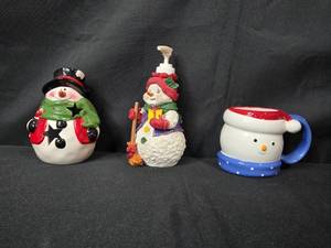 lot 162 image: Set of Snowman Figurines Candle Holder, Soap Dispenser, and Mug