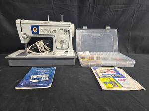 lot 181 image: Singer Model 477 Zig-Zag Sewing Machine with Instruction Manual & Accessories
