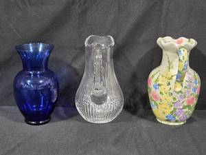lot 201 image: Set of 3 Vases Cobalt Blue Glass, Clear Crystal, and Hand-Painted Floral Ceramic Pitcher