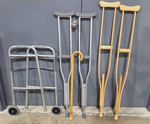 lot 225 image: Assorted Mobility Aids Foldable Walker, Crutches, and Cane