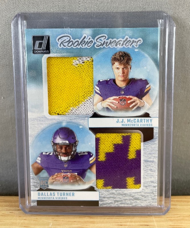 lot 46 image: 2024 Panini Donruss JJ McCarthy, Dallas Turner Rookie Sweaters #RHD-MIN T