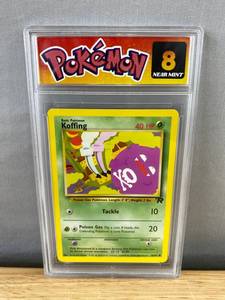 lot 208 image: Koffing Team Rocket Pokemon Card - Graded 8 Near Mint T