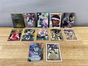 lot 254 image: 12 Deion Sanders NFL Football Cards - Mix of Teams J
