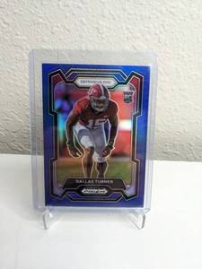 lot 427 image: 2023 Panini Prizm Draft Picks Dallas Turner RC Blue Prizm Numbered 107199 NFL Minnesota Vikings M