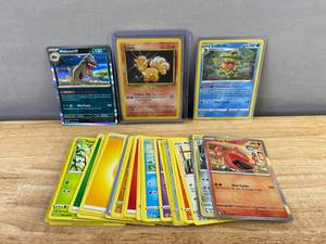 lot 744 image: 48 Pokemon Trading Card Lot - Holo, Vulpix, Pikachu & More N