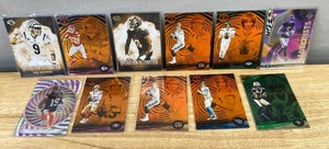 lot 809 image: 2022 Panini Illusions NFL Football Insert 11 Card Lot - Rookies & Stars J
