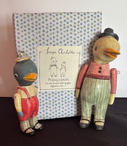 lot 70 image: Frozen Charlottes Mr. Harvey and Little Pete Figurines