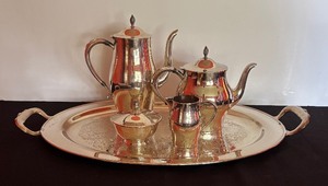 lot 19 image: Elegant Silver Plated Coffee and Tea Service including Platter, Coffee Pot, Teapot, Sugar Dish and Creamer Pitcher