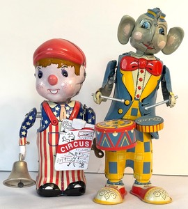 lot 111 image: T.K. Toys News-Boy Clockwork Tin Wind Up Toy  &  Fossil Elephant Drummer