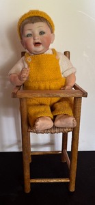 lot 243 image: Vintage German Character Doll with Chair