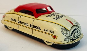 lot 316 image: Louis Marx & Co. 1905s Vintage Max Safe Driving School Litho Wind-Up Toy Marked Car #1, Learn to Drive and Dual Control