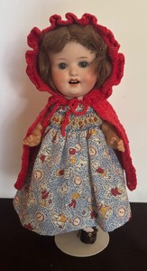lot 426 image: Simply Adorable 11 Doll with Dress and Knit Red Cape