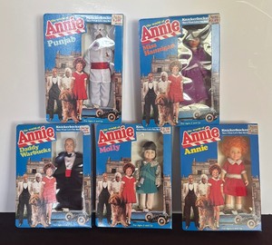 lot 497 image: The World of Annie Dolls including Annie, Daddy Warbucks, Miss Hannigan, Punjab and Molly