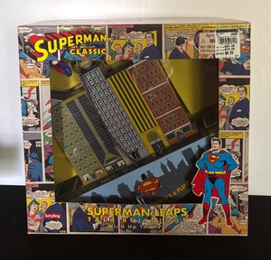 lot 546 image: New Superman Leaps Tall Buildings Wind Up Toy by Superman Classics