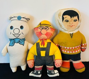 lot 140 image: Vintage Pillsbury Doughboy Plush Doll, Poppin Fresh, Eskimo Pie Boy Doll and Nestle Little Hans the Chocolate Maker Rag Doll.