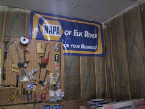 lot 105 image: Hand tools and supplies on garage w...