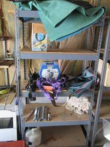 lot 171 image: Content of shelf including ATV tire...