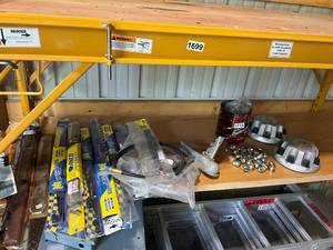 lot 716 image: Assorted Automotive Parts Including Wiper Blades, Coupler, and Hubcaps