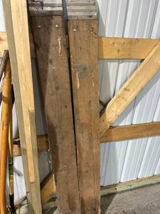 lot 777 image: Pair of Heavy-Duty Wooden Beams with Metal Reinforcements
