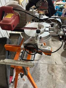 lot 797 image: Tool Shop 10 Inch Sliding Compound Miter Saw with Stand