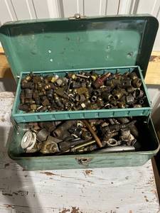 lot 829 image: Green Metal Toolbox with Assorted Brass and Steel Plumbing Fittings