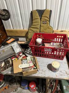 lot 834 image: Vintage Fishing Gear Collection with Tackle Boxes, Lures, Bobbers, and Humminbird Unit
