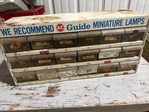 lot 835 image: Vintage Metal Storage Cabinet with Assorted Drawers and Labels
