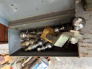 lot 839 image: Metal Toolbox with Assorted Trailer Hitch Balls and Mounts