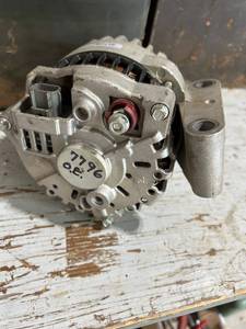lot 852 image: Automotive Alternator with Pulley and OEM Markings