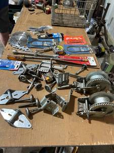 lot 899 image: Collection of Garage Door Hardware, Winches, Saw Blades, and Band Saw Blades