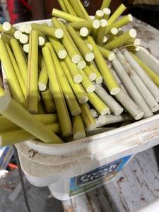 lot 863 image: Bucket of Assorted Round Plastic Rod Stock