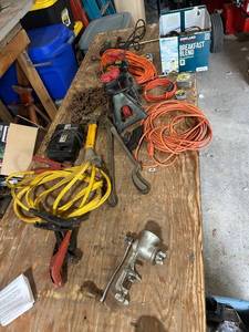 lot 870 image: Garage Tool Collection with Jack Stands, Jumper Cables, Extension Cords, and Hand Tools