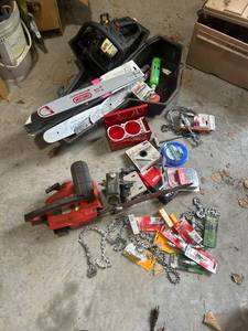 lot 882 image: Chainsaw and Replacement Parts Lot with Bars, Chains, and Accessories