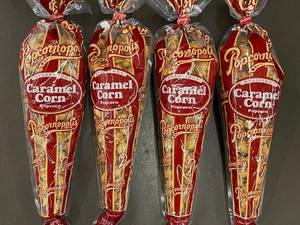 lot 31 image: 4 Packs of Popcornopolis Caramel Corn Popcorn 7oz Each