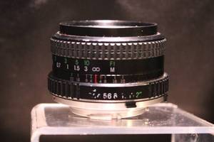 lot 21 image: Cosina 28mm f2.8 MC Lens with Leather Case
