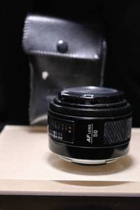 lot 33 image: Minolta Maxxum AF 50mm f1.7 Camera Lens with Case